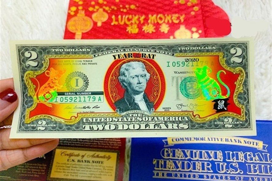 Rao ban 300.000 dong mot to 2 USD co hinh chuot ma vang hinh anh