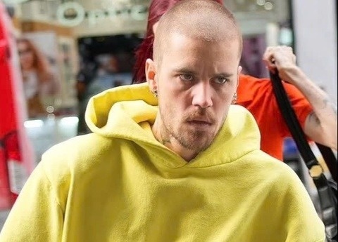 Justin Bieber tra no hang chuc trieu USD hinh anh