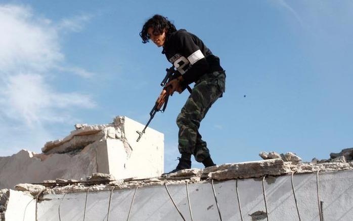 Libya loay hoay xu ly hang tram thi the linh IS trong nha xac hinh anh