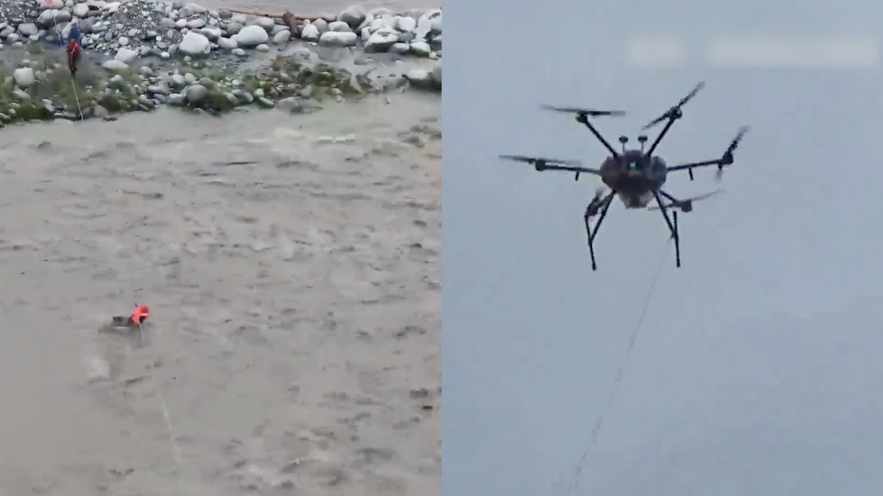Dung drone giai cuu 2 nguoi bi mac ket giua song o Trung Quoc hinh anh
