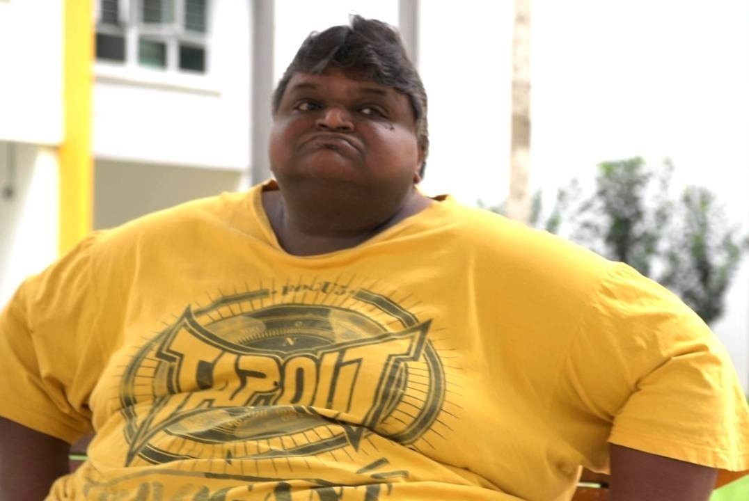 Nguoi dan ong nang 212 kg o Singapore anh 1