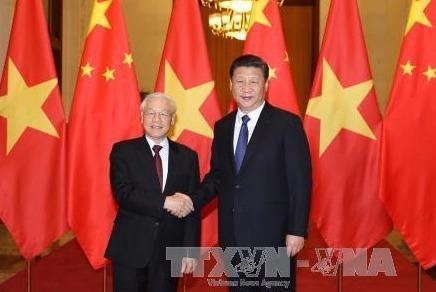 Lanh dao Viet - Trung trao doi dien mung 67 nam kien giao hinh anh