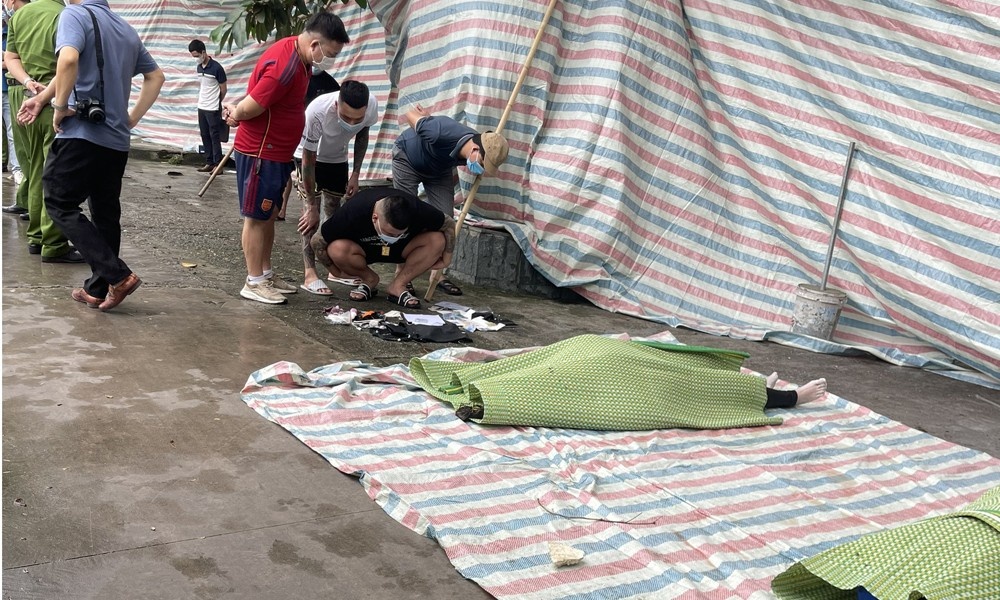 Cong an Bac Giang dieu tra thi the doi nam nu noi tren mat ho hinh anh