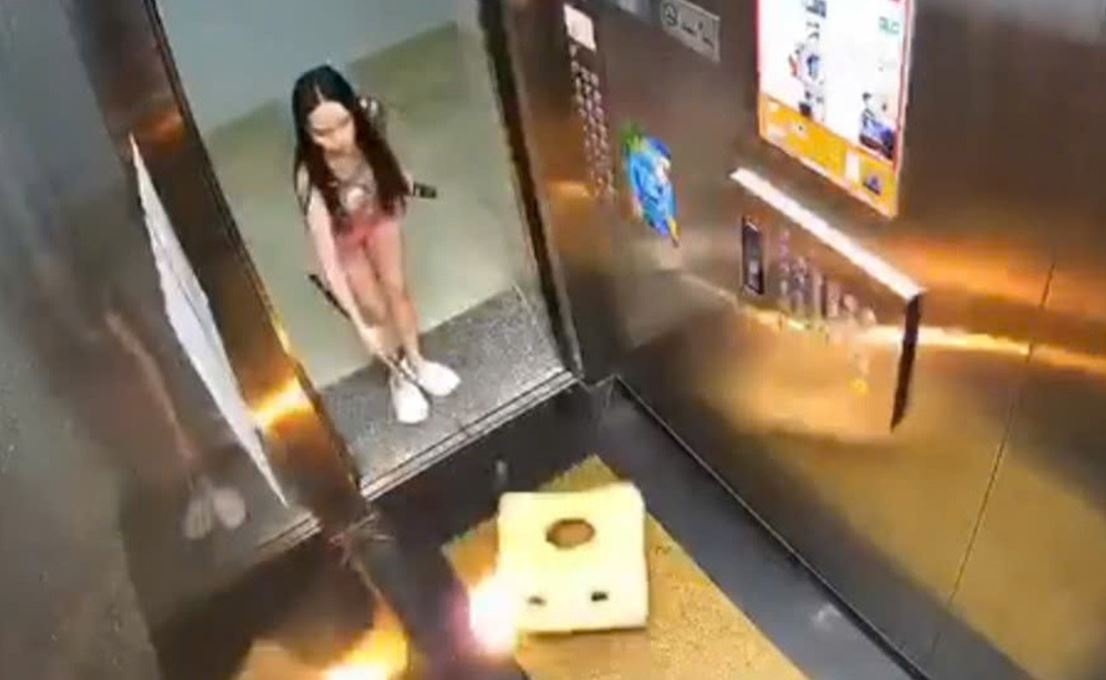 Co gai nem vat chay vao thang may chung cu o Vung Tau hinh anh