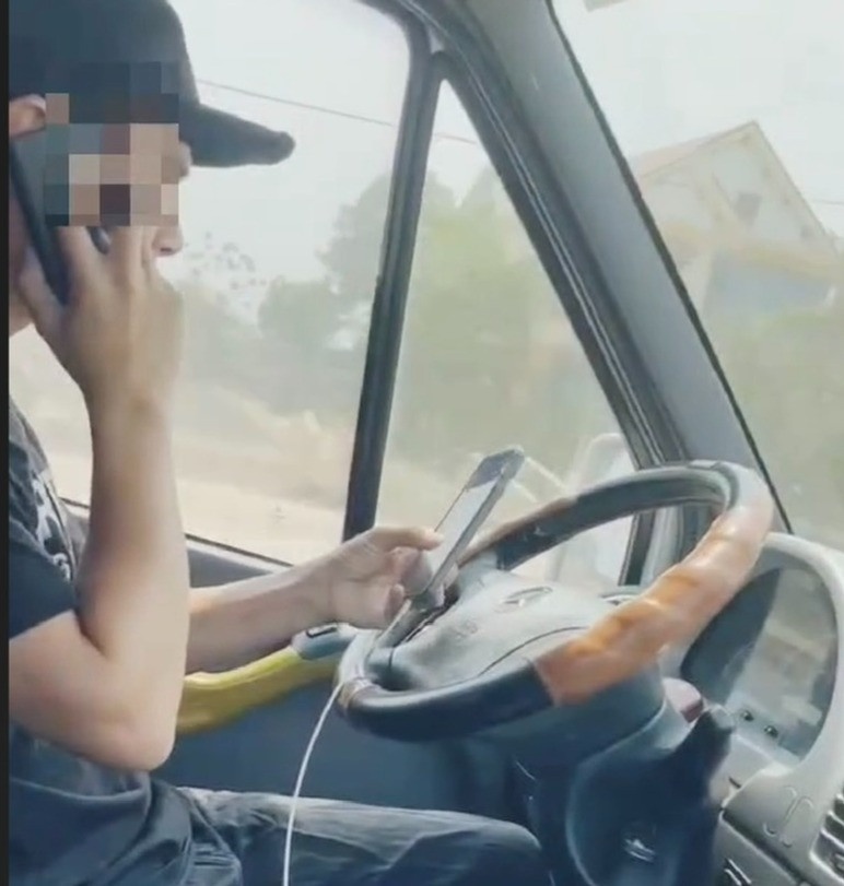 lai xe dung dien thoai anh 1