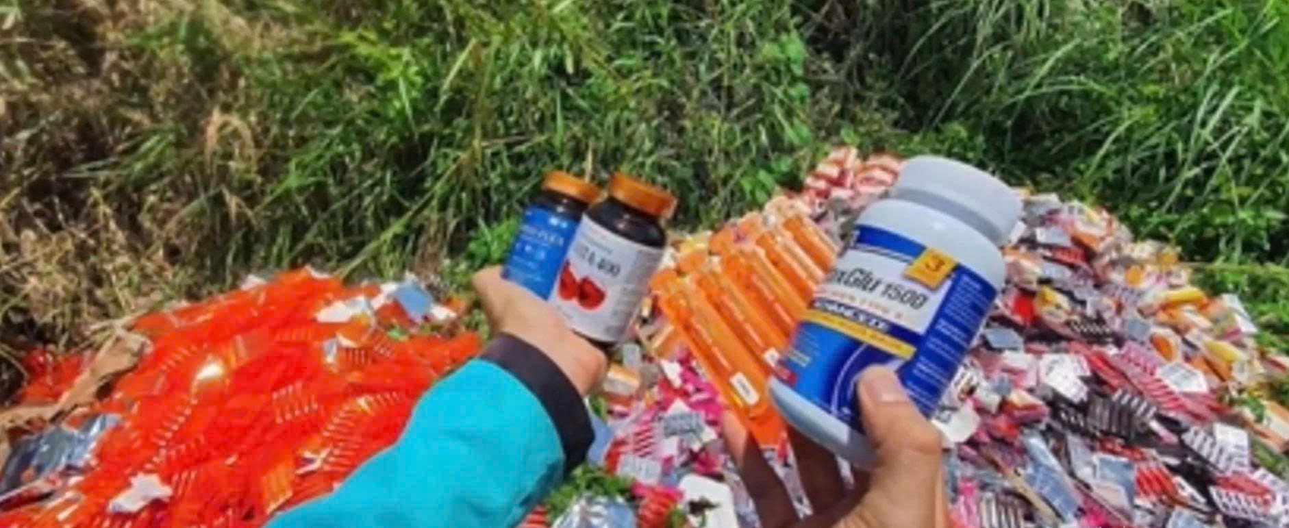 Video nguoi dan phat hien hang nghin hop thuc pham chuc nang, vi thuoc bo la liet tren duong hinh anh