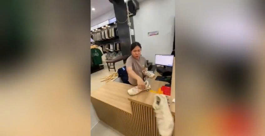 Xac minh vu nhan vien shop thoi trang nem giay vao mat khach Tay hinh anh