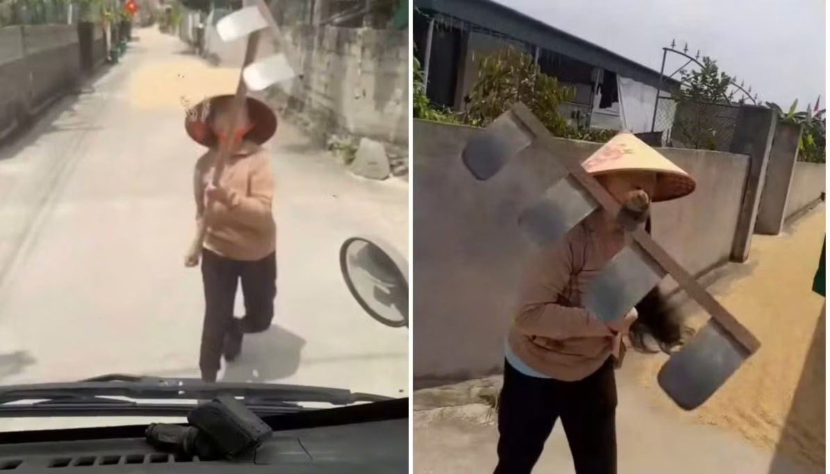 Phoi lua lan duong, nguoi phu nu dung cao chan xe tai, tan cong tai xe hinh anh