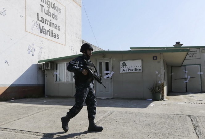 Mexico: Phat hien 60 thi the trong mot lo thieu cu hinh anh