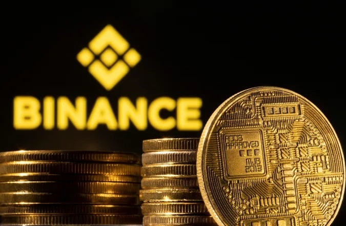 Binance bi loi dung rua tien anh 1