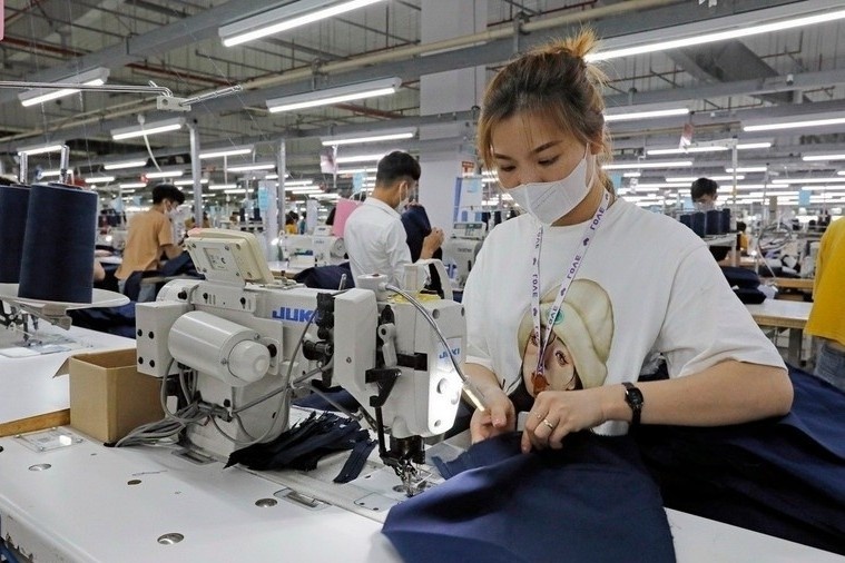 Thue doi ung 20%: Doanh nghiep tim cach thich ung hinh anh