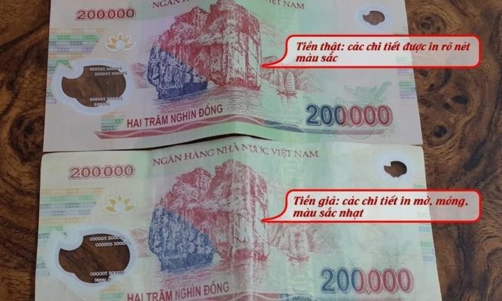 Tien gia 200.000 dong xuat hien lai: Cach phan biet de tranh bi lua hinh anh