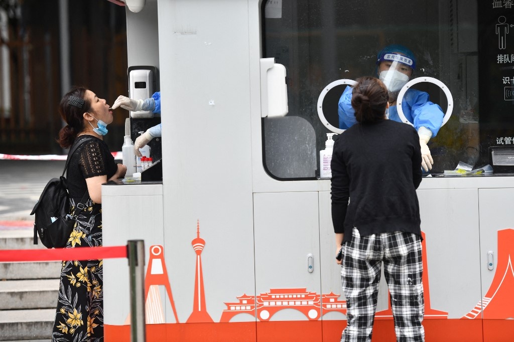 Trung Quoc phong toa thanh pho 21 trieu dan hinh anh