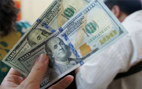 Dieu chinh ty gia, co hoi giam lai suat bi thu hep? hinh anh