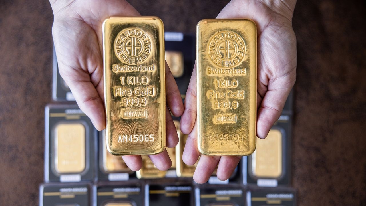 Gia vang the gioi du bao tang tiep tuan toi hinh anh