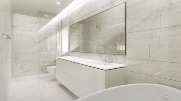 Phòng tắm được ốp hoàn toàn bằng đá hoa cương sáng.