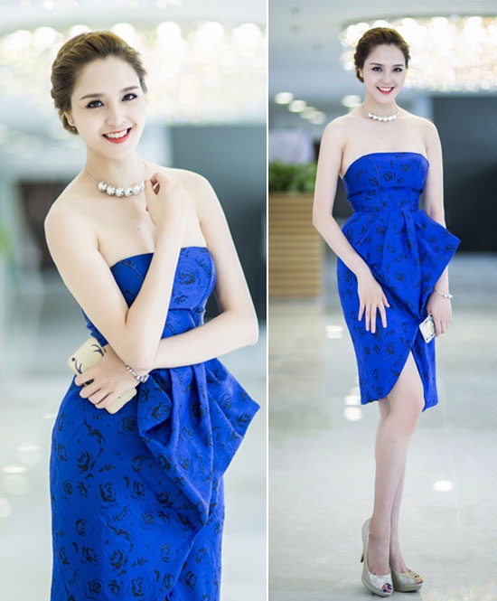 Trong bộ đầm xanh cúp ngực với chi tiết xếp ly 3D ở phần eo, Á hậu Việt Nam 2012 Hoàng Anh thu hút sự chú ý bởi làn da trắng mịn màng, bờ vai thon thả, đôi chân dài nuột nà.