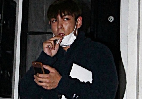 T.O.P (Big Bang) ne tranh khi bi chup anh tu tap dem hinh anh