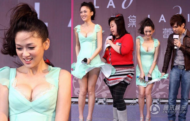 Trần Kiều Ân khi tham dự sự kiện quảng cáo ngoài trời lúng túng vì váy ngắn. Người đẹp không thể tiếp tục giao lưu với khán giả trong chương trình vì mải đưa tay cân chỉnh trang phục.