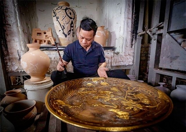 Gom Viet tiep tuc xac lap 2 ky luc Guinness the gioi hinh anh