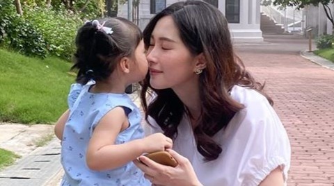 Hoa hau Dang Thu Thao lay lai voc dang thon gon sau sinh hinh anh