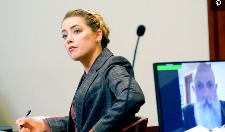 Amber Heard tan cong Johnny Depp anh 1