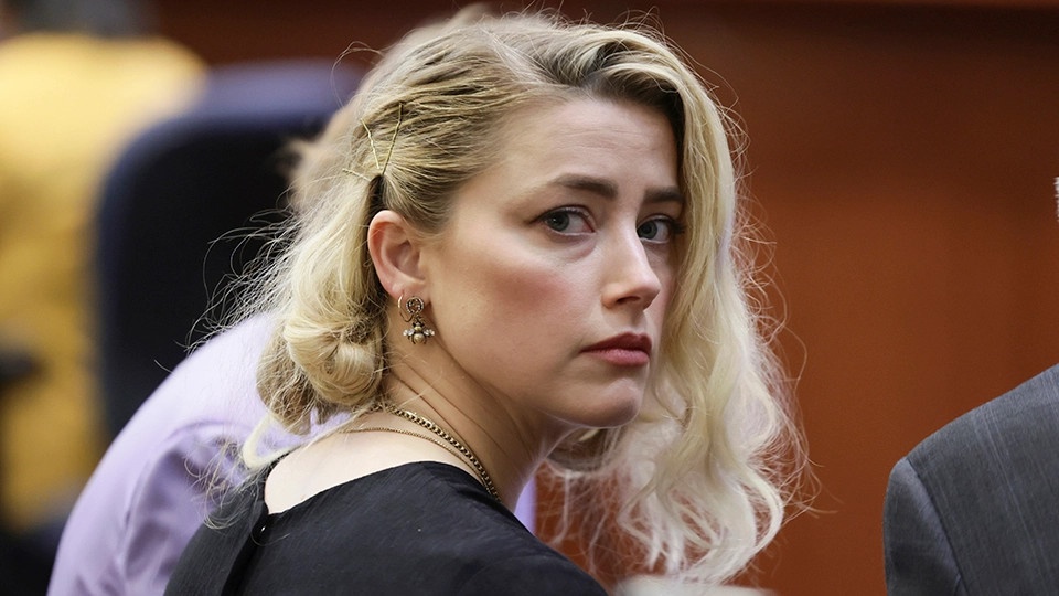Amber Heard kho thang neu khang cao hinh anh