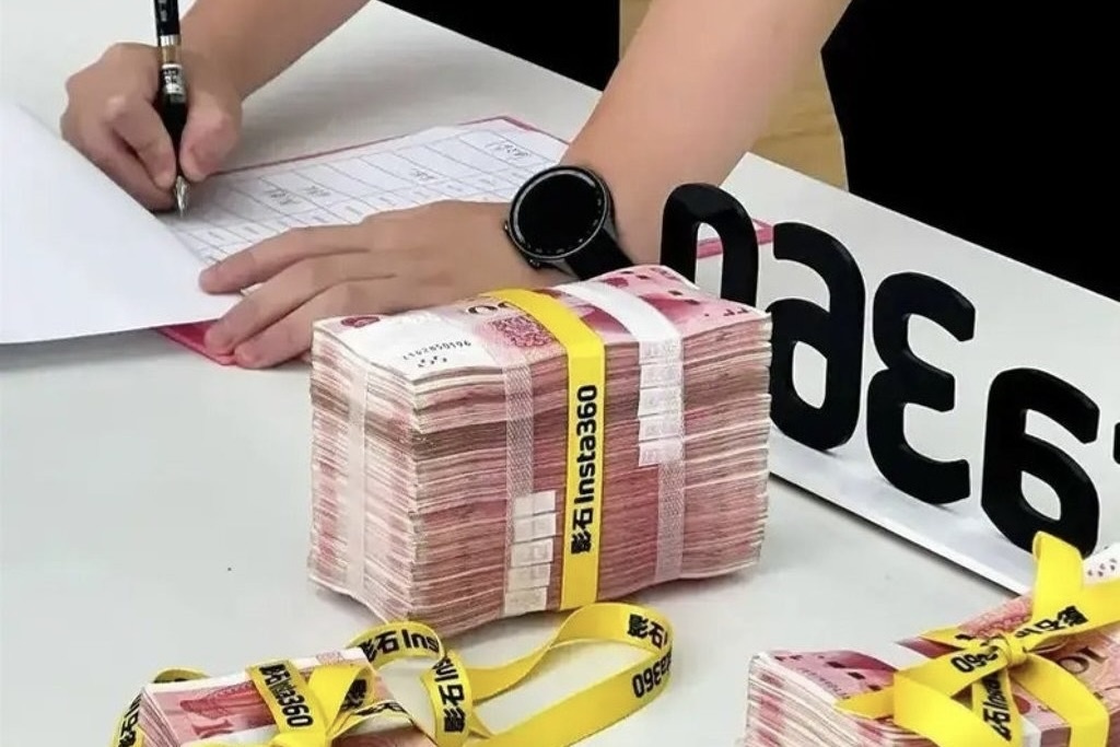 Cong ty Trung Quoc thuong tien ty cho nhan vien giam can hinh anh