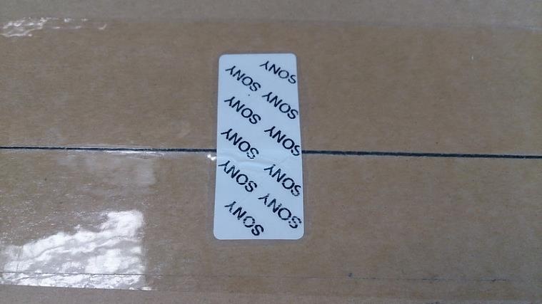 Tem đảm bảo trên nắp thùng