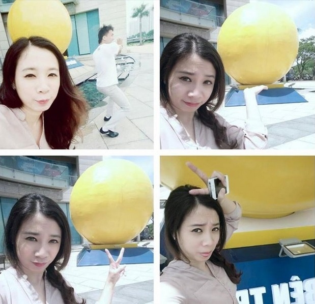 Facebooker nick name Lê Thảo đăng hình ảnh selfie bên quả bóng vàng khổng lồ với chú thích hóm hỉnh: “Cam giống gì mà to thế”.