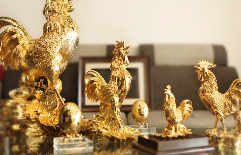 Qua Tet Dinh Dau y nghia voi bo suu tap tuong ga ma vang hinh anh