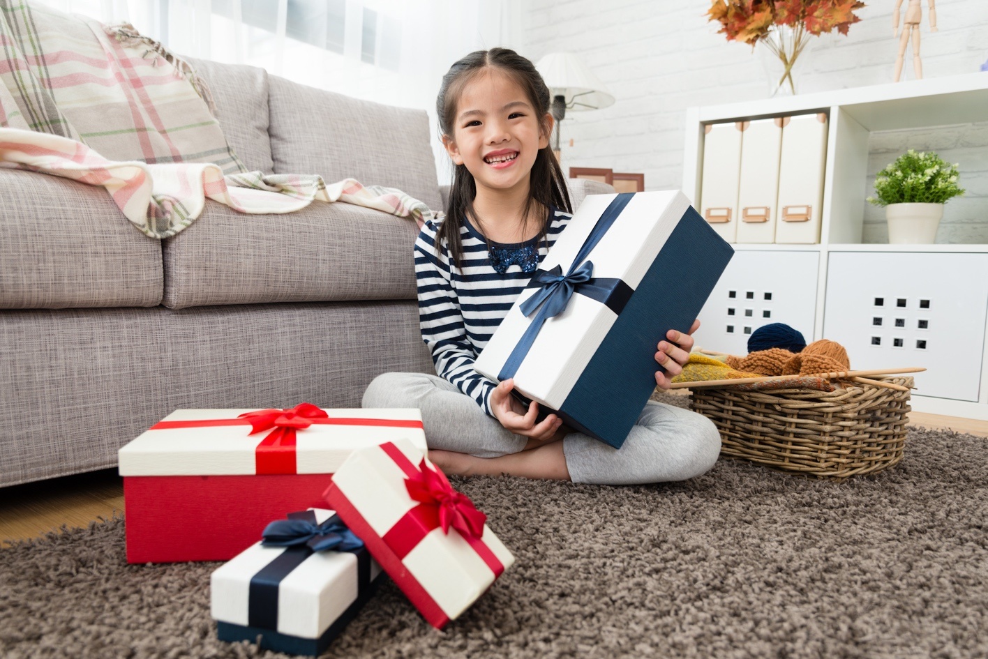 Girl with many Gifts. Girl holding present Box. Make presents.