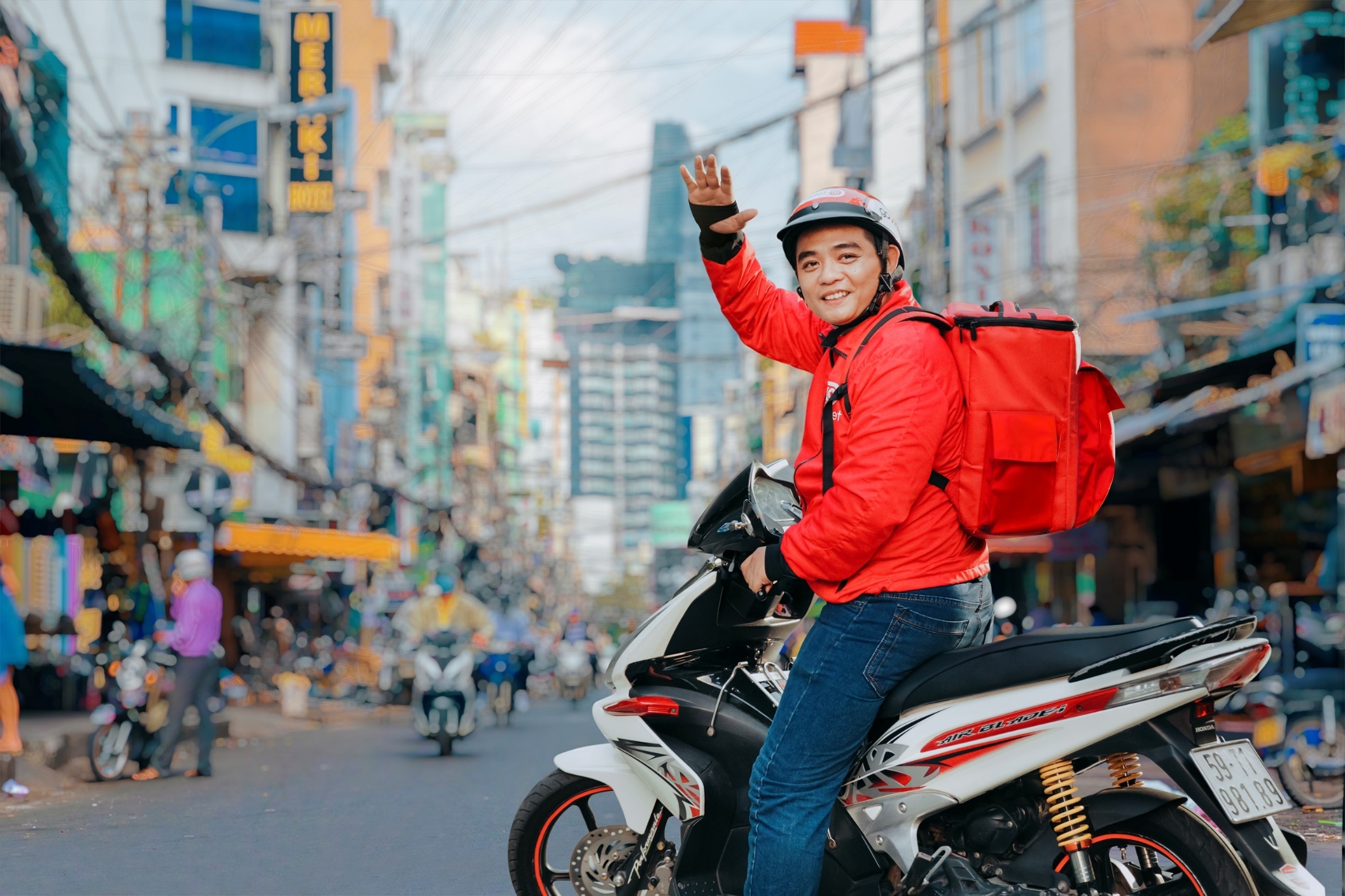 Go-Viet mo rong dich vu dat xe, giao hang tai 12 quan noi thanh TP.HCM hinh anh