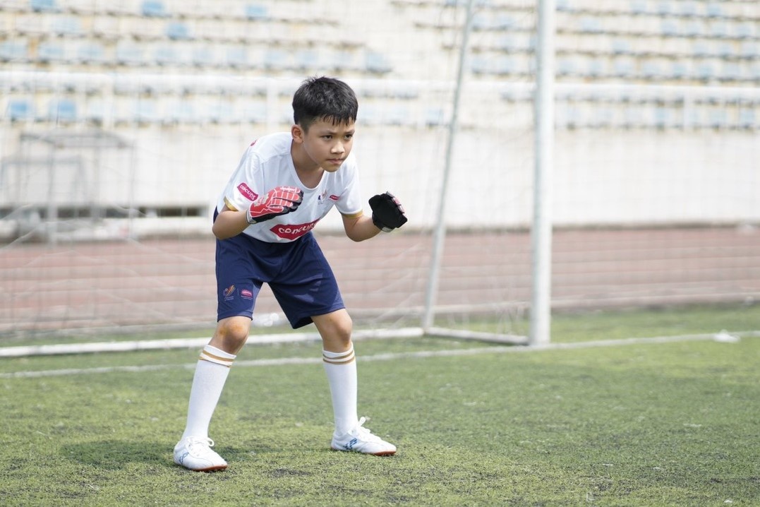 Em bé tháp tùng tuyển thủ ảnh 3 Em be thap tung tuyen thu anh 3