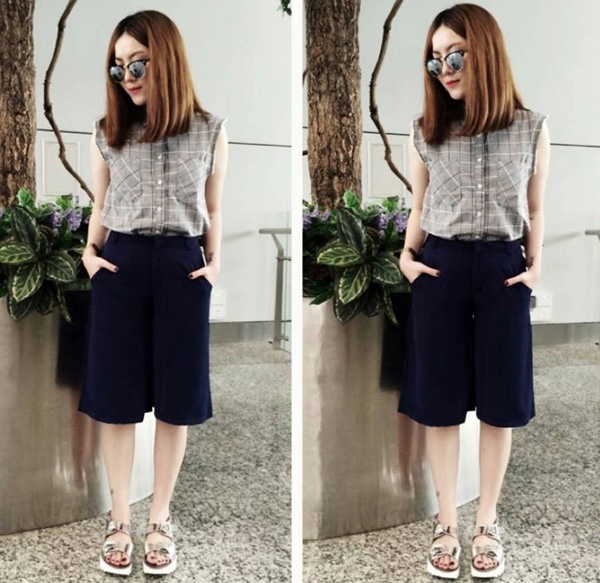 Yến Trang trẻ trung với quần culottes và áo sơ mi kẻ sọc ba lỗ rất hợp xu hướng.