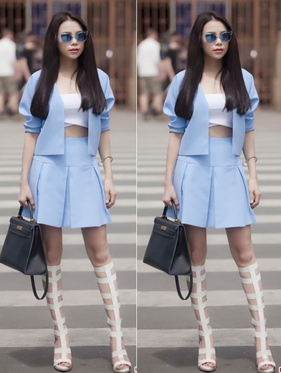 Trà Ngọc Hằng luôn biến hóa đa dạng với nhiều item và cô cập nhật nhanh những xu hướng thịnh hành. Bộ đồ màu xanh mix cùng xăng đan dây và túi đen là set đồ rất ấn tượng.