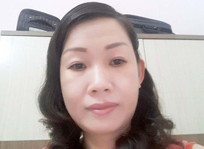 Bat giam nu giam doc to 'bi cuop 4 bao tai tien' ve toi vu khong hinh anh