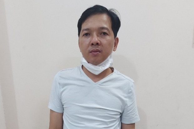 Nguoi dan ong bi bat sau 5 nam bo tron sang Malaysia hinh anh