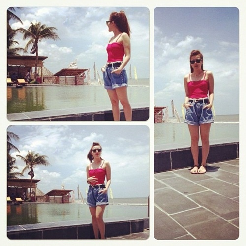 Muốn khoe chân thon, bụng gọn như Yến Nhi thì áo hai dây lửng và short là lựa chọn cơ bản và dễ dàng nhất cho bạn.