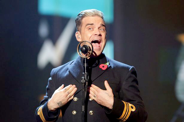 Robbie Williams nga gay tay fan hinh anh