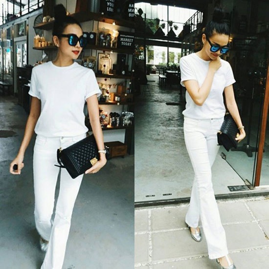 Diện cả cây trắng nhưng Thanh Hằng lại tinh tế mang theo túi xách màu đen huyền bí. Với dáng người cao, gầy thì đây là gợi ý rất lý tưởng.
