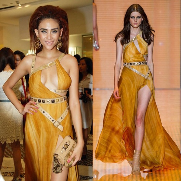 Một tuyệt phẩm sexy có chừng mực đến từ thương hiệu Versace đã bị Hoàng Yến phá tan vì khoe vòng một kệch cỡm, bên to bên nhỏ. Lối trang điểm “dọa ma” và mái tóc vuốt phồng cũng hoàn toàn không phù hợp với thiết kế này.