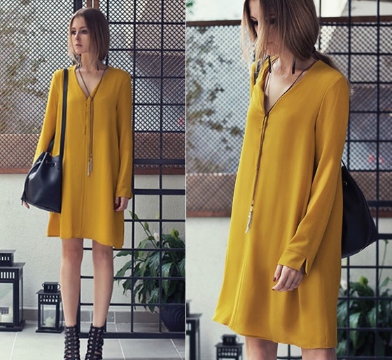 Váy dáng suông dài tay mang nét đẹp đơn giản nhưng không kém phần cuốn hút.