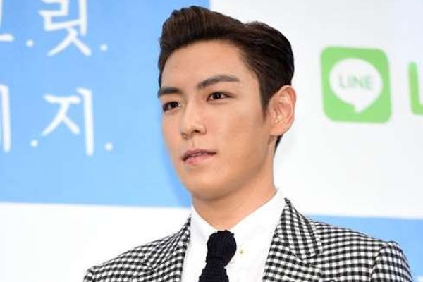 T.O.P (Big Bang) xin loi vi xa rac bua bai o Trung Quoc hinh anh