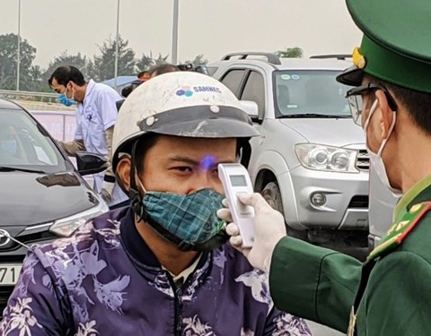 Ha Noi thu hoi phuong an lap chot chan nguoi ra vao thanh pho hinh anh