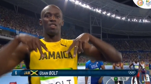 Khoanh khac vui nhon cua Usain Bolt truoc khi chay 200 m hinh anh