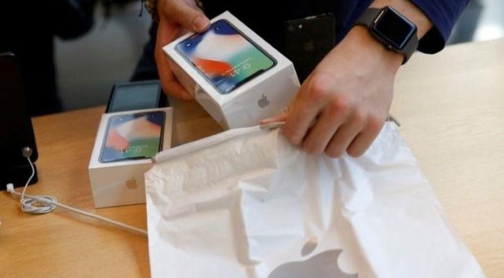 Hai nguoi Viet bi bat o Nhat Ban vi gian doi de doi iPhone hinh anh