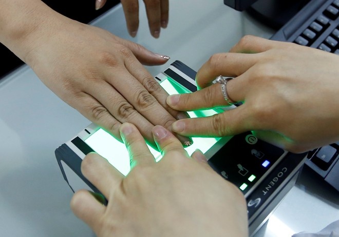 Nguoi khong co van tay lam CMND kieu moi the nao? hinh anh