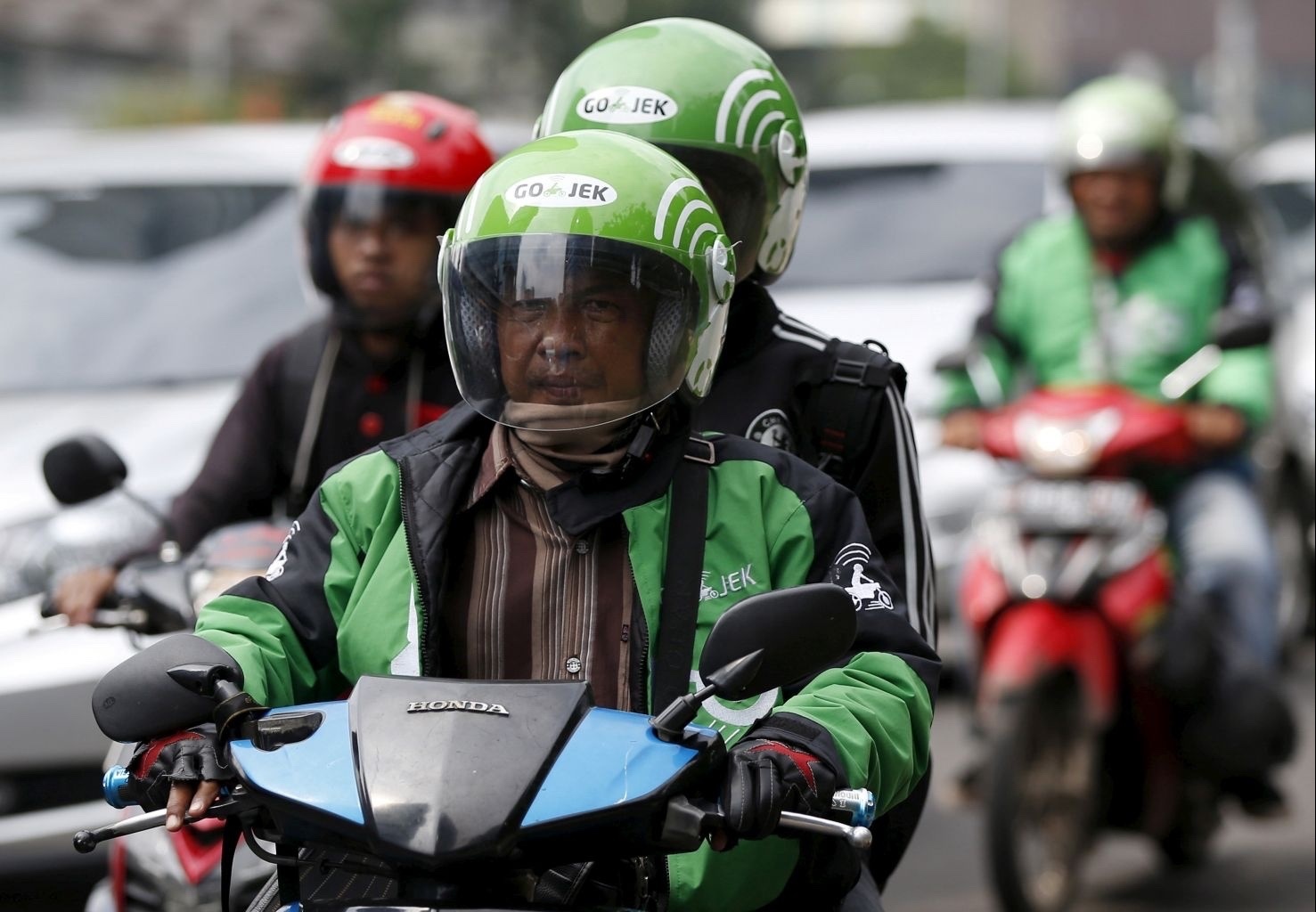 Grab, GoJek chi trả an sinh cho đối tác tài xế ở các nước như thế nào?