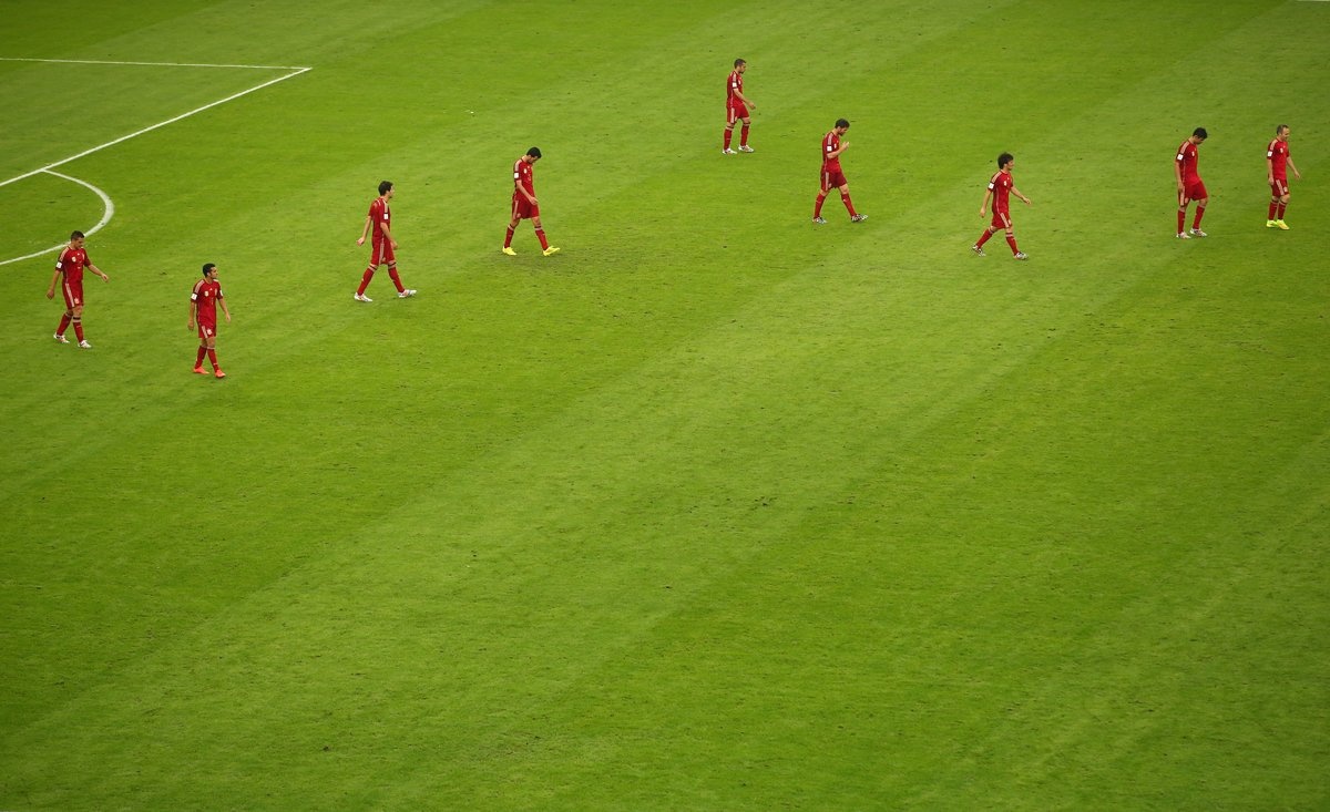 a-dejected-spain-walks-off-the-pitch-after-losing-to-chile.jpg
